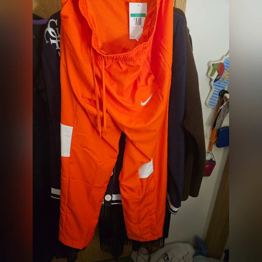 NIKE Orange Wide Leg Track Pants With Elastic Tie Waist. Snap Button Bottoms